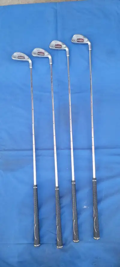 Dunlop golf clubs, including numbers 4, 5, 6, and 8. QUARDRA LINK. -----$10 each------