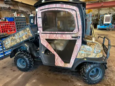 Kubota RTV 900 with tracks and three way snow plow