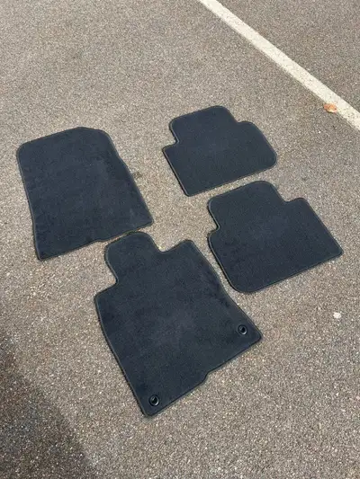 These are a set of Honda Civic floor mats designed for the 2021 to present model years, providing a...
