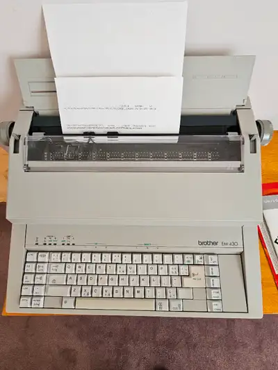 Brother electronic typewriter in very good working condition. Model EM-430 Includes ribbon cartridge...