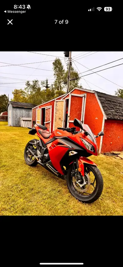 This is a vibrant, used Kawasaki Ninja motorcycle, ready to inject some excitement into your rides....