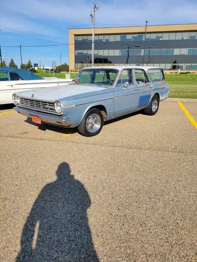 1965 Valiant Custom 200 wagon. Has a 273ci V8 that runs extremely well, truly purrs and is mated to...