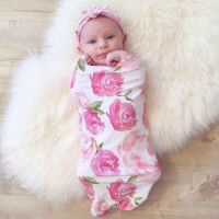 Baby girl swaddle and matching carrier cover