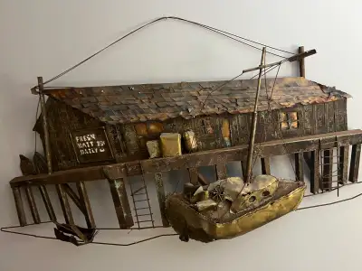 80$ 42 inch by 16 inch This used unique metal wall art depicts a weathered fishing shack with a boat...