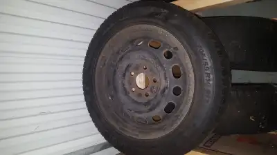 Affordable set of four used winter tires with rims. See pics for condition.