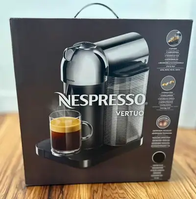 Brand new Nespresso Vertuo, round-head coffee machine. Black matte colour. The milk frother was used...