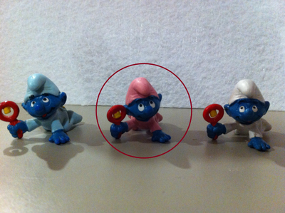 Smurfs - Vintage Baby Smurf in Pink sleeper with Red Rattle Toy, View more