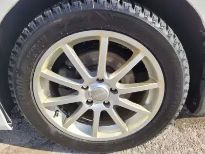 Aluminum rim. The rims are the same size. However, 2 tires of 225/50R17. and 2 tires of 225/55R17. O...