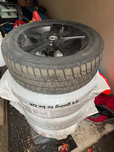 Rims and snow ties that I purchased new from Fieldings Kingston in October 2018. Rims are in very go...