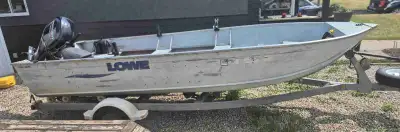 New motor last year has small chip on foot 2 years warranty remaining 18 foot long 1880 lowe boat v...