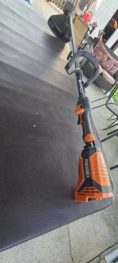 This Ridgid 18V Cordless String Trimmer, brushless Used a couple times No batteries