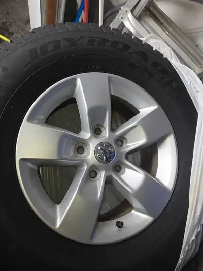 A set of four Dodge Ram 1500 alloy rims 17" with winter tires. Two the tires are good as new the oth...