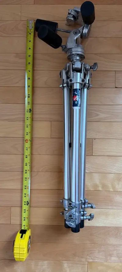 This vintage Manfrotto Silver Jubilee 190 tripod, paired with the 141RC head, is a sturdy and reliab...