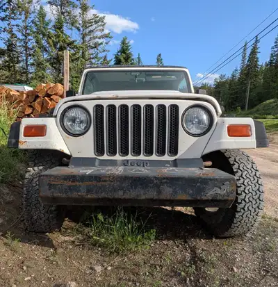 Got a 98' TJ for sale Something happened to the engine,not sure what. Could be timing chain,could be...