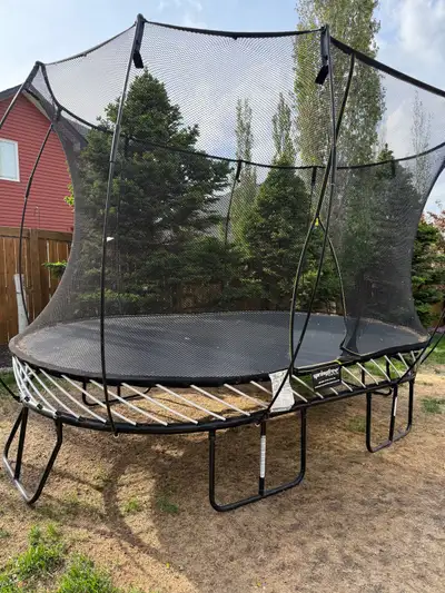 Like new Springfree 8ft x 13ft Large Oval trampoline. 9 ft high with the enclosure. Includes V1 grou...