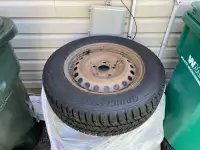 4 winter Bridgestone Blizzak tires on rims
