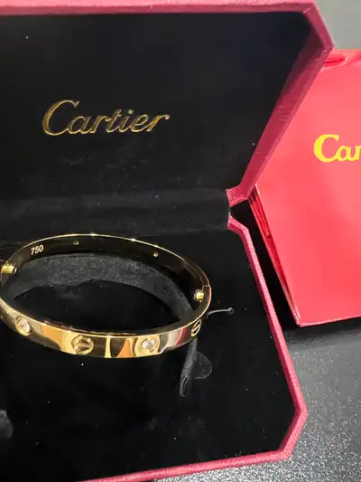 Up for sale is a beautiful Cartier gold bracelet, a timeless piece of luxury jewelry. This elegant b...