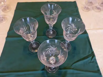 Set of 4 vintage pinwheel design crystal glasses measuring 7 inches tall. These have been in the fam...