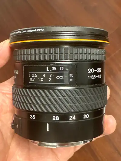 Capture breathtaking wide-angle shots with this pre-owned Tokina 20-35mm 1:3.5-4.5 lens, designed in...