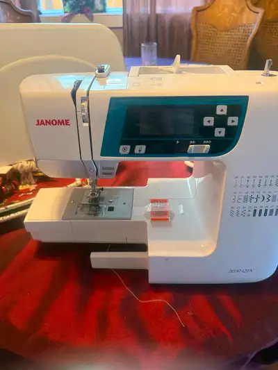 Janome sewing machine with attachments. just serviced. priced brand new $1400.00 asking