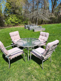 Patio set including four chairs and table