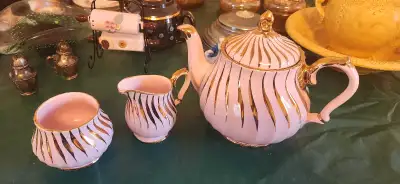 Estate items Light set: Sadler White and Gold Swirl Teapot set, made in England. $55 Dark set: Alcoc...