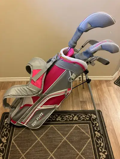 Gently used set of kids golf clubs. Includes the bag, one putter, one sand wedge, two irons and two...