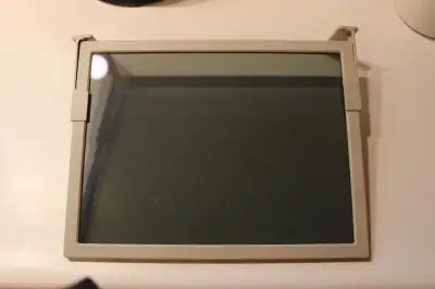 This screen, which measures 13 inches wide by 10 inches high, hangs from the top of your computer mo...