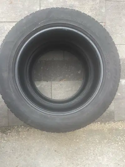 This is a Pirelli Scorpion Winter tire, size 235/55R18 104H M+S. It is a used tire in good condition...