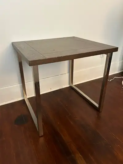 Selling a strong wooden table with metal legs in good condition. Clean, modern design and very sturd...