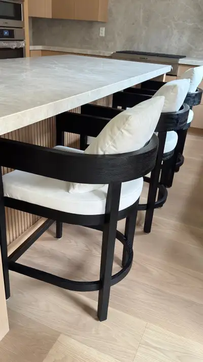 Restoration Hardware Balmain counter stools in black solid oak with natural colour off white fabric....