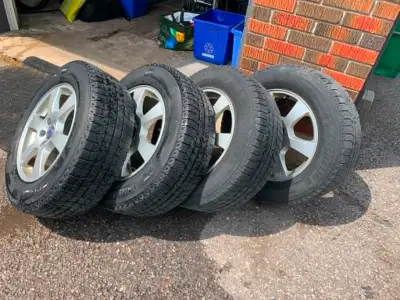 Set of 4 Alloy wheels with Michelin Latitude snows size 235/65R17 on them. Wheels are in good shape...