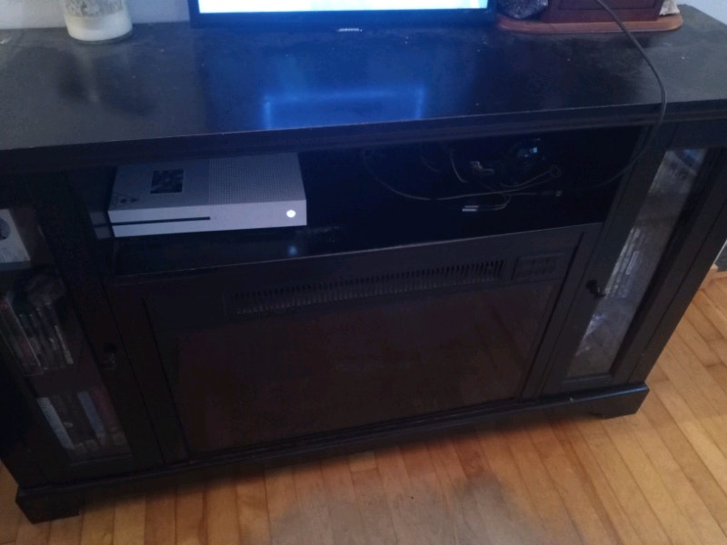 Electric fireplace with side doors/shelving. Fireplace & Firewood