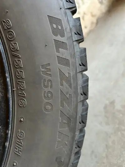 Lightly used 4 winter tires, Bridgestone Blizzak WS90. Comes with 4 winter tires on steel rims and 4...