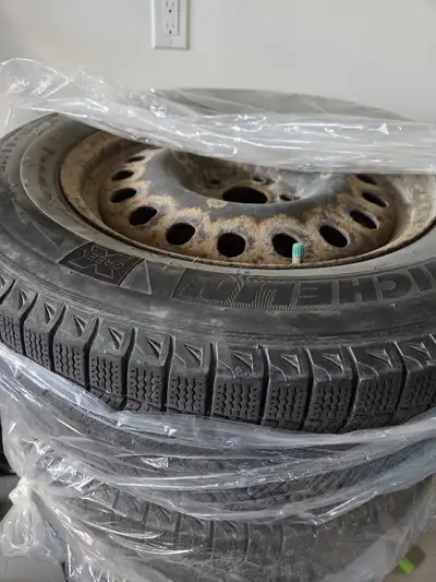 I'm selling a set of four Michelin Latitude Xi-2 winter tires, size 235/65R17, mounted on steel rims...