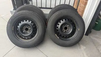 4 x P235/65R18 Continental WinterContact Tires on Steel Rims from a Nissan Murano, it's good conditi...