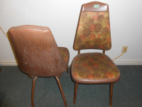 Pair of plastic upholstered chairs with metal legs