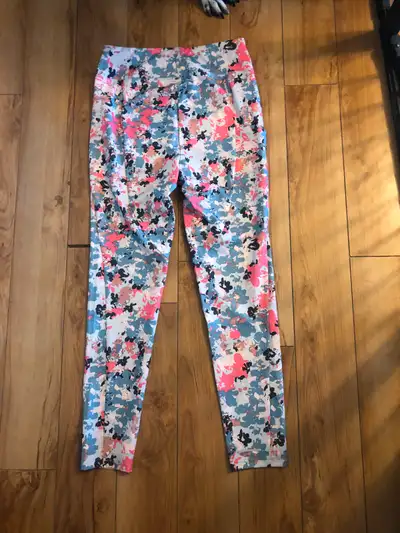 Great tights for spring. Side pocket. Quick-drying material. Girls' Size 18-20. Brand new with tags.