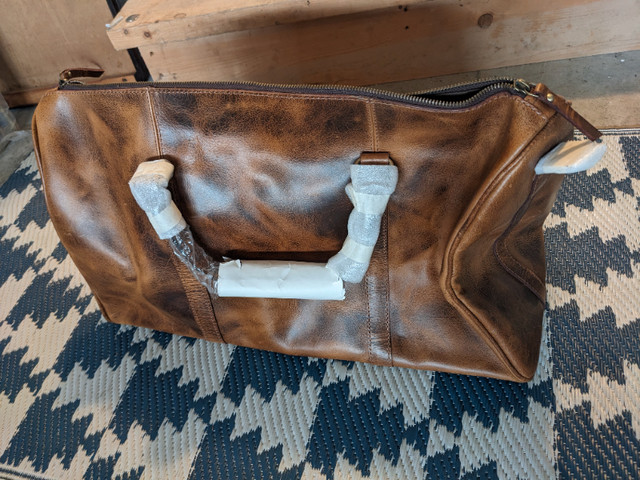 Rustic leather duffle travel bag in Men's in Campbell River