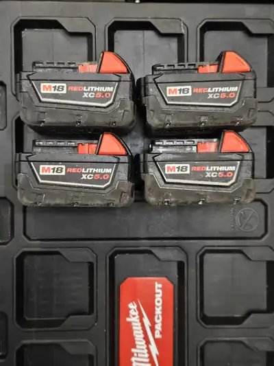 four 18v 5.0 extra capacity battery by Milwaukee. they are used altough in good working condition al...