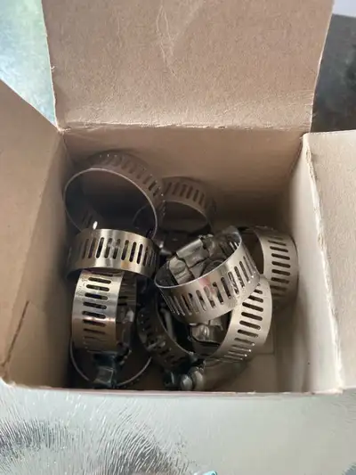 I am selling a box of mixed size hose clamps. These are in used condition. Please examine the photos...