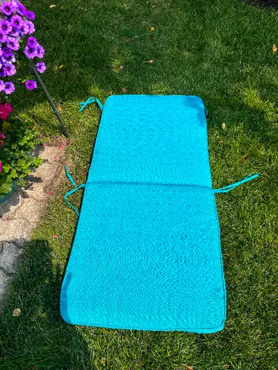 6 Teal Coloured Patio Chair Cushions 21 ‘’ wide by 47 ‘’’ long 3 ‘’ thick $15 each (Must sell as a s...
