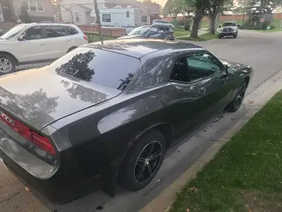 Dodge Challenger scratch on the left side, as in the picture. It is SE, and is 2009. Comes with 4 ad...