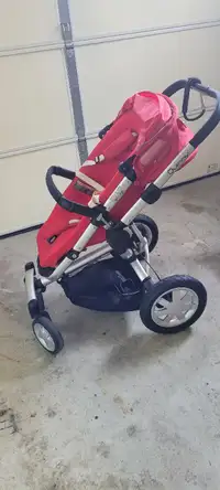 Red Quinny stroller with baby seat attachments