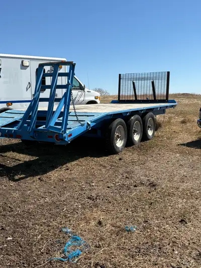 20’ heavy duty flat deck trailer 16’ deck plus 4’ beaver tail, 3- 10 000 lb axels electric brakes. P...