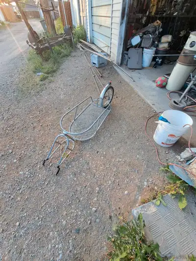 Factory single wheel cargo trailer, heavy duty. Has been custom modified to fit on most Ebikes. Loca...