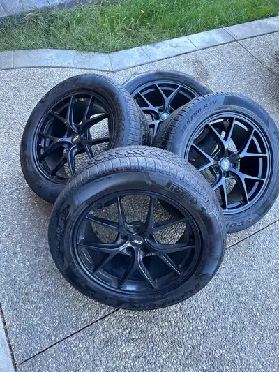 Complete set of 4 Pirelli Scorpion winter tires mounted on 19” RTX black alloy rims with TPMS sensor...