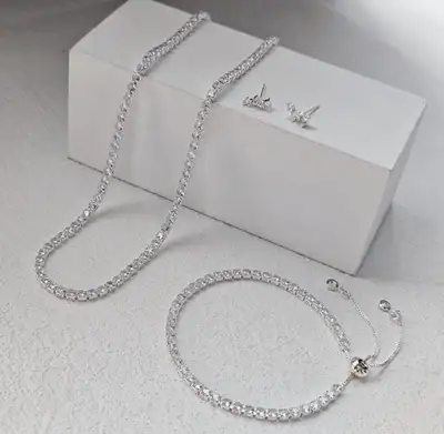 ***Elegant jewelry set includes a tennis necklace, a tennis bracelet, and a pair of stud earrings. -...