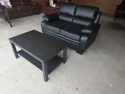 New black leather loveseat & center table.Free delivery disposal, View more