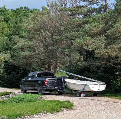 Precision 15 sailboat (2014), centerboard model. With highway ready trailer this boat is easy to tow...
